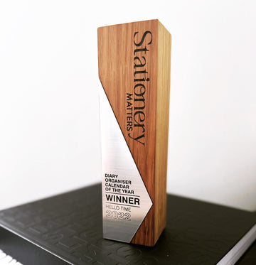 HELLO TIME’s Stationery Matters Award 2022 for Diary, Organiser & Calendar of the Year — a sleek wooden and metal trophy celebrating thoughtful design and productivity.