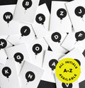 Set of monochrome children’s birthday cards featuring balloon designs with initials A to Z.