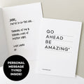 Open greetings card showing personalised handwritten message beside “Go Ahead Be Amazing” cover.
