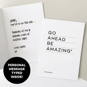 Open greetings card showing personalised handwritten message beside “Go Ahead Be Amazing” cover.