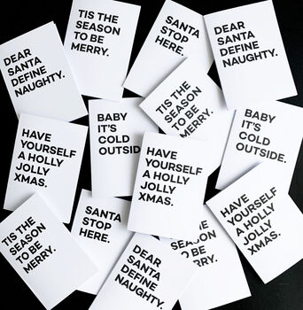 Collection of monochrome Christmas cards with bold black festive quotes on white backgrounds.
