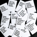 Small thumbnail view of Christmas card pack with bold black festive quotes on white backgrounds.