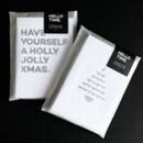 Pack of Christmas quote cards wrapped in Hello Time packaging with text “Have Yourself a Holly Jolly Xmas” and tree design visible.