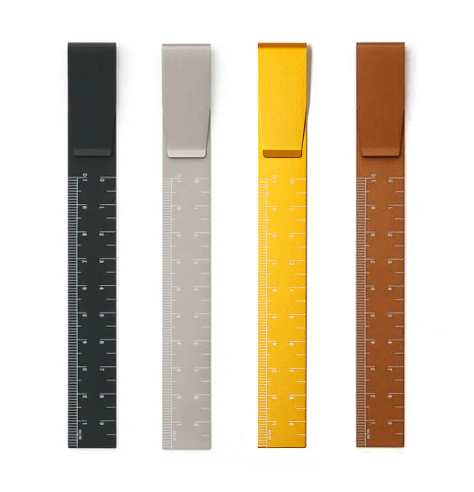 Four clip ruler bookmarks in black, grey, yellow and bronze on white background