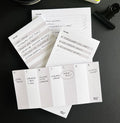 Flat lay of HELLO TIME desk pads including time-task, braindump, weekly, and mini list pads, with handwritten notes on each.