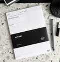 HELLO TIME My Day daily planner pad on terrazzo desk with pen and cap