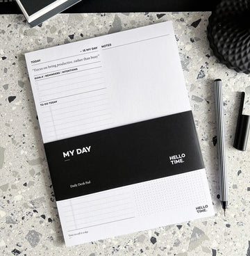 HELLO TIME My Day daily planner pad on terrazzo desk with pen and cap