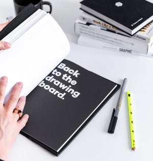 Open black HELLO TIME notebook with 