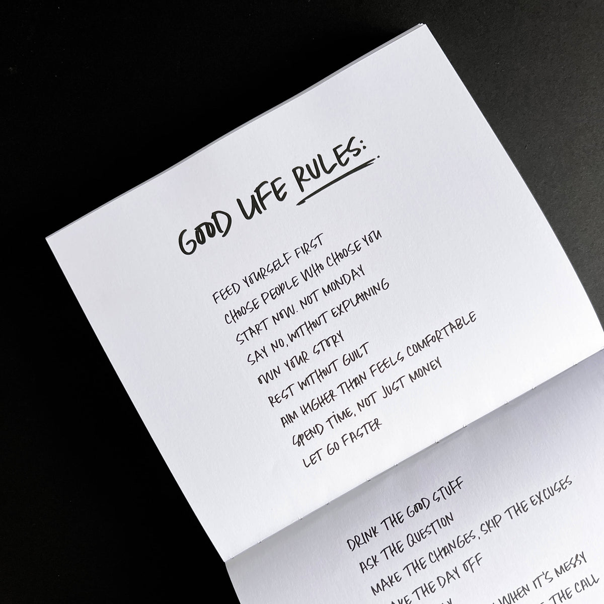 Open HELLO TIME notebook page with handwritten "Good Life Rules" list on black background.