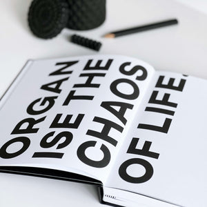 Open black-and-white HELLO TIME planner with bold 