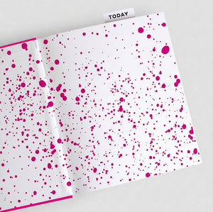 Open HELLO TIME pink planner with pink inkwell endpaper pattern and 