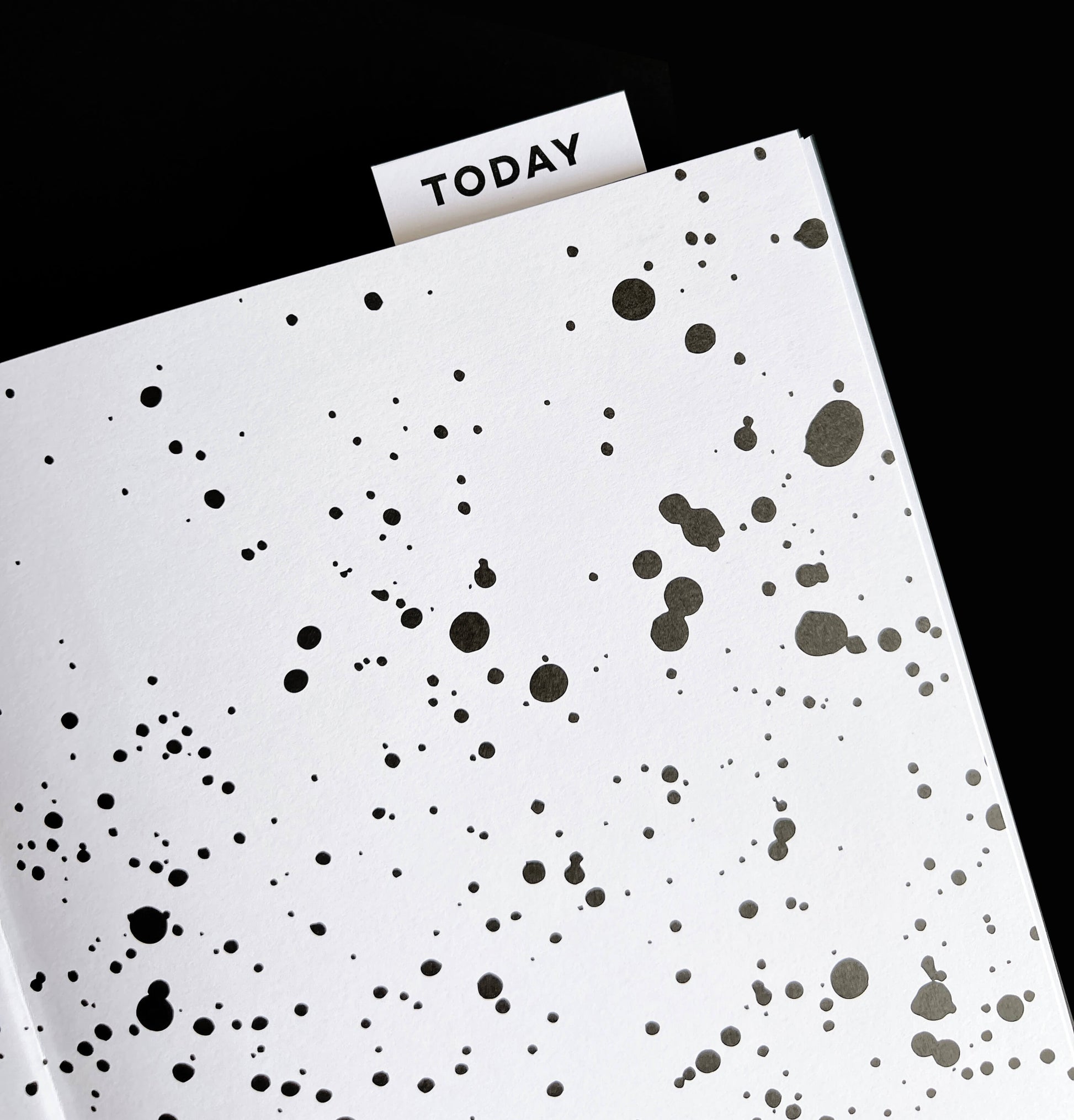 Black and white HELLO TIME planner with inkwell design and “Today” page marker tab visible