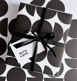 Black and white geometric gift wrap design with black sparkle ribbon and 'with love' gift card.