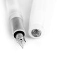 Close-up of Kaweco Sport fountain pen nib and cap, translucent coconut white finish with silver detailing