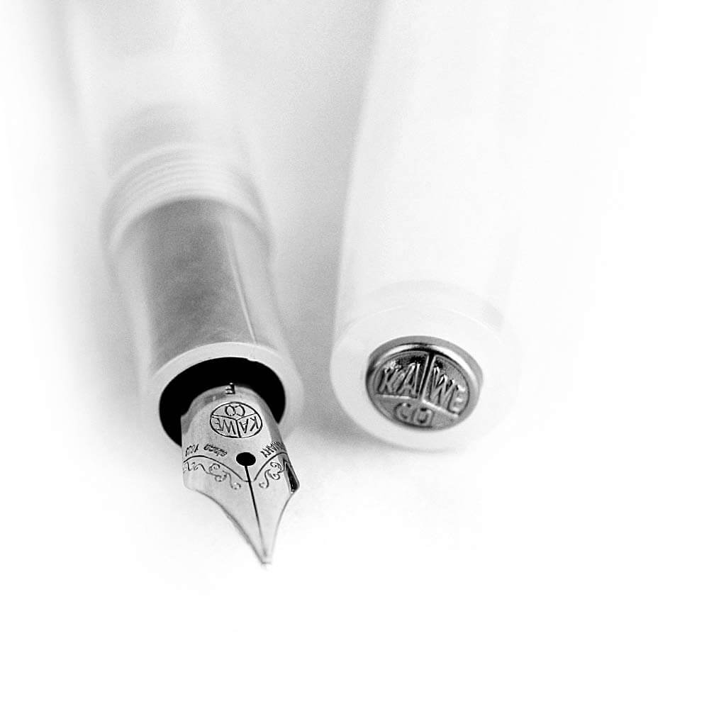 Close-up of Kaweco Sport fountain pen nib and cap, translucent coconut white finish with silver detailing