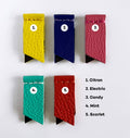 Five luxury leather magnetic page markers in citron, electric, candy, mint and scarlet on white background