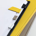 HELLO TIME magnetic leather page markers in yellow, clay, white and black clipped to grid notebook pages
