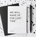 White greetings card with “We will make up for lost time” text, black envelope and pen.