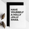 White card with bold black text reading “Have Yourself a Holly Jolly Xmas.”