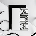 White greetings card with bold black MUM typography, paired with black envelope.