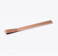 Copper metal ruler bookmark with clip, marked with centimetre scale.