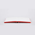 Nuuna LOVE notebook lying open flat with red-edged white pages