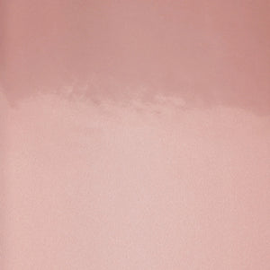 Close-up of shiny rose gold cover on the Nuuna A6 notebook.