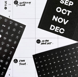 Wall planner page with activity stickers and handwritten plans like haircut and yoga