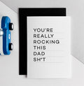 White greeting card with black text reading 