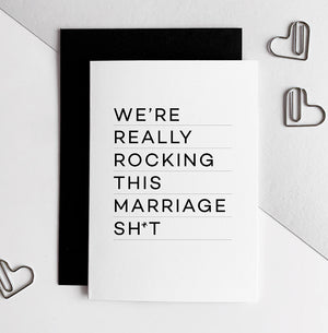 White anniversary card with bold black text reading 