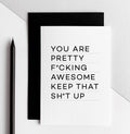 White birthday card with black text reading ‘You are pretty fcking awesome keep that sht up’ and black envelope.