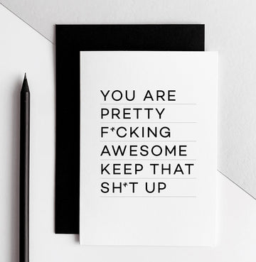 White birthday card with black text reading ‘You are pretty fcking awesome keep that sht up’ and black envelope.