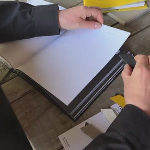 HELLO TIME video of placing magnetic leather page markers into a HELLO TIME Planner page